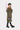 Military green twill trench coat with officially licensed Joy Division Love Will Tear Us Apart reference, genderless film-noir silhouette