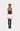Model wearing the COME ON Pink Faux Fur Mini Skirt with a black crop top and knee-high boots, back view
